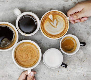 mugs with various coffee drinks in them, placed in a circle