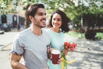 Happy couple walking outside in the city