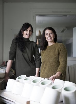 Ment founders Ingvild and Sidsel pose in front of their work