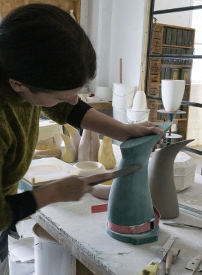 Ment, artist creating a water jug for UNDER