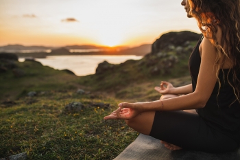 woman doing yoga outdoors