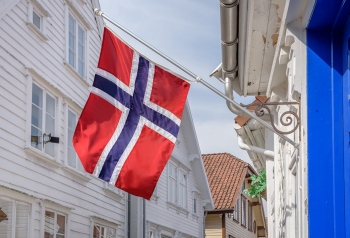 Norwegian flag flying from building