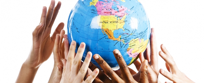 multiple hands grabbing a globe