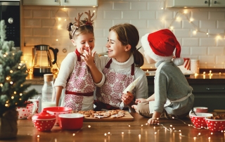 mother and children bake christmas cookies