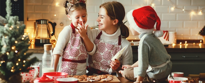 mother and children bake christmas cookies